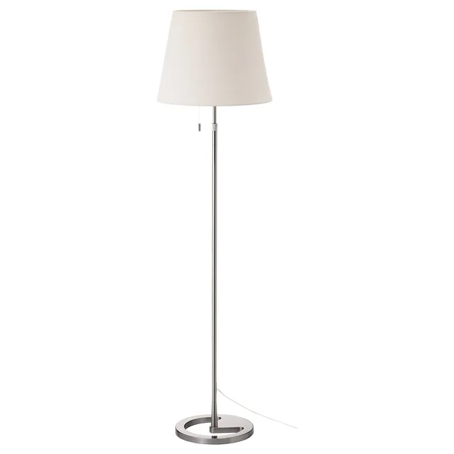 Slender nickel-finish floor lamp with a white shade and circular base.