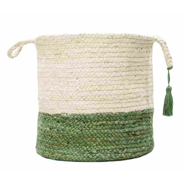 White and green woven jute basket with handles and green tassels.