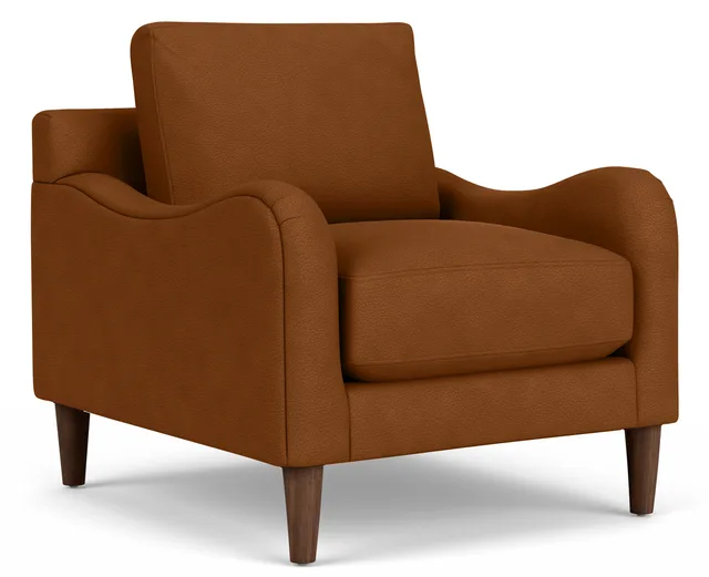 Cognac leather armchair with curved arms and tapered wooden legs.